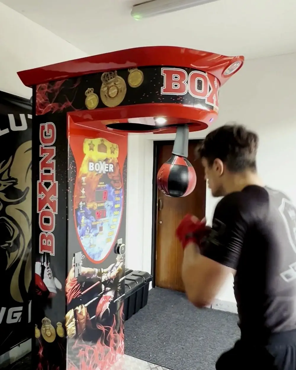Boxer punching the bag on a boxing arcade machine for sale