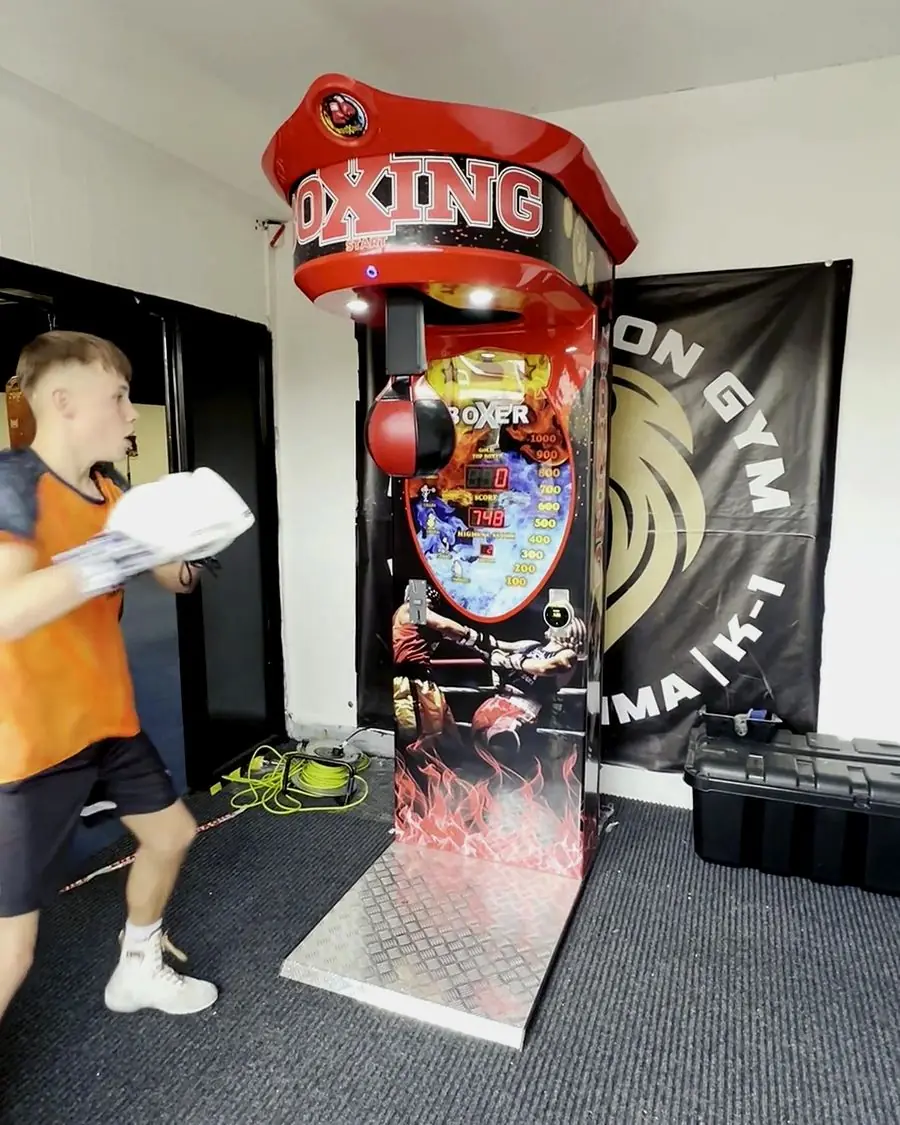Boxing arcade machine installed in a gym